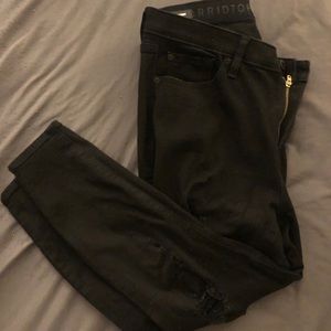 Distressed black skinny jeans